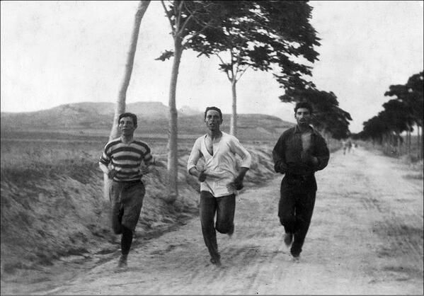 Three men running in the first marathon at the 1896 Summer Olympics